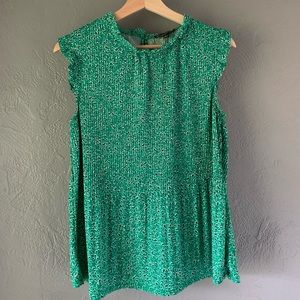 Beautiful floral tank with ruffled sleeve detail.